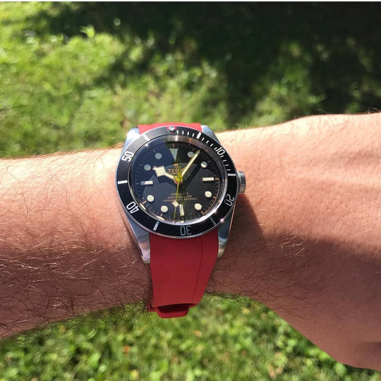 Tudor Heritage Black Bay with Red Strap on Wrist